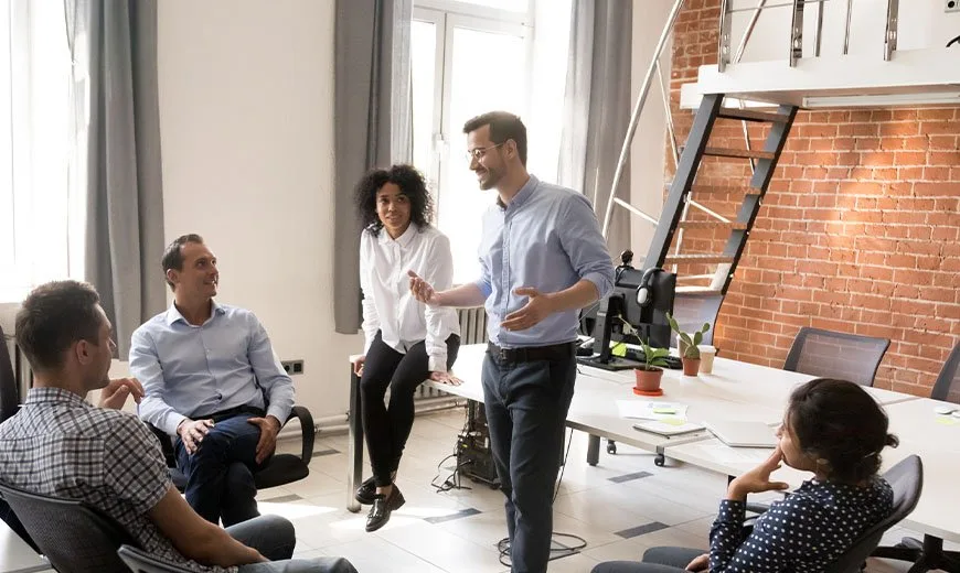 Man talking in front of a group of people